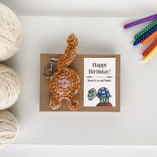 Orange tabby cat butt keychain with funny turtle birthday card