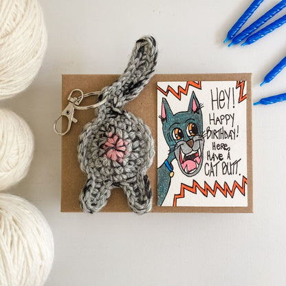 OOAK birthday art card with gray cat butt keychain on a Kraft box