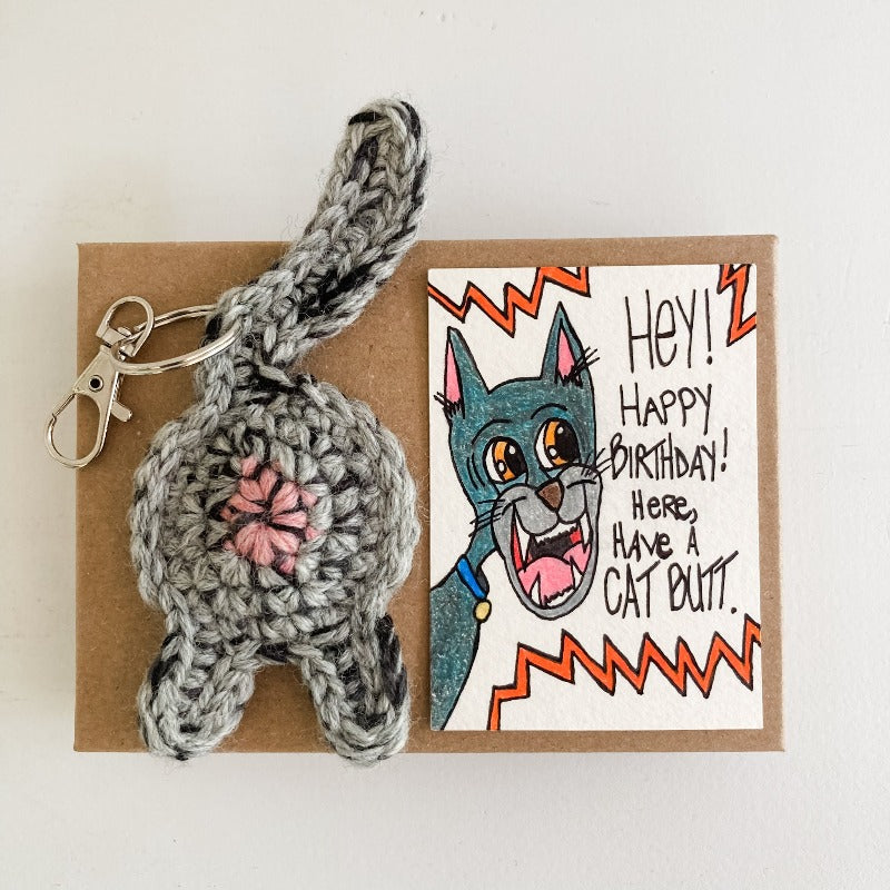 OOAK birthday art card with gray cat butt keychain on a Kraft box